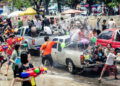 Locals celebrate Thai New Year by throwing water at one another, Songkran water festival, Chiang Mai, Thailand